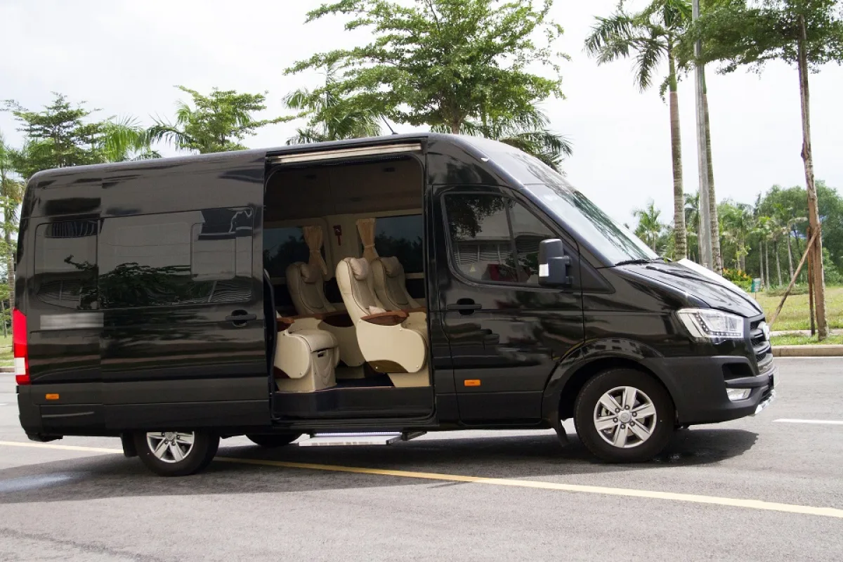 vietnamtour Modern air-conditioned vehicle for a Phong Nha cave private transfer with family inside.