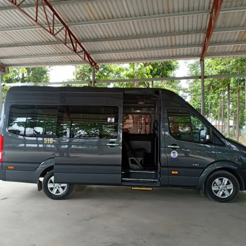 vietnamtour Smiling driver assisting passengers during a Vietnam private car multi day journey through the countryside